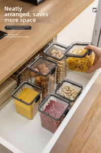 Detail of airtight clear food storage containers organized in a drawer for grains and pasta