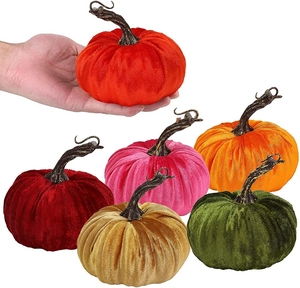 Close-up of six colorful velvet harvest pumpkins for Thanksgiving home decor accents