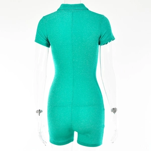 Detailed back view of green sequin romper featuring a lapel collar and hidden zipper