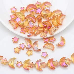 Close-up of iridescent AB coating star and moon glass beads for DIY jewelry making
