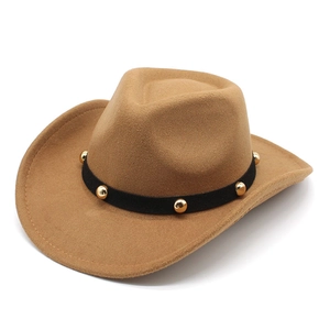 Close-up of brown wool felt cowboy hat with black band and gold metallic rivets details