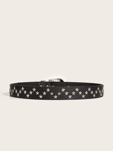Detail of black leather punk belt featuring silver star studs and metallic pin buckle