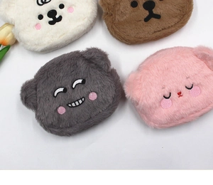 Detailed display of four plush cartoon bear coin purses in white brown grey and pink colors