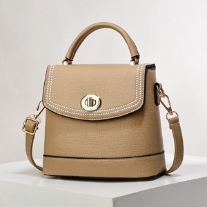 Elegant khaki lychee leather crossbody bag with top handle and gold rotating clasp