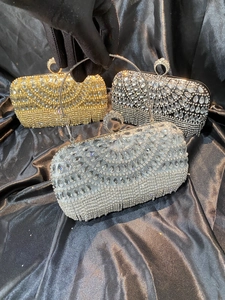 Exquisite rhinestone evening clutch bags in gold and silver with elegant metal handles