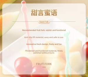 Detailed view of pink and green two-prong fruit forks in a thick, non-slip PP material
