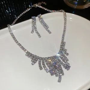 Luxury zircon square tassel necklace and drop earrings set on a white elegant platter
