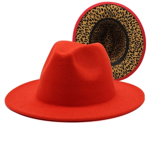 Classic red fedora with leopard print lining and wide brim for men and women
