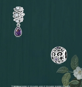 Detail of S925 silver water drop pendant with purple zircon and floral bead charms