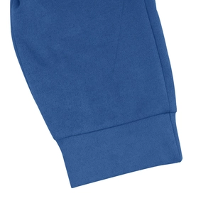 Detailed close-up of blue suede tracksuit cuff with high-quality stitching and texture