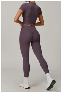 Rear view of purple seamless high-waist yoga set with slim fit leggings and crop top