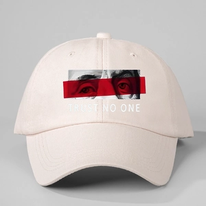 Detail of Trust No One printed cotton baseball cap with artistic facial graphic
