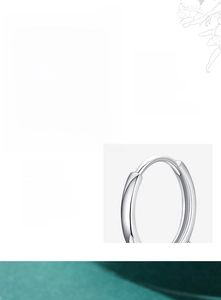 Macro detail of S925 sterling silver hoop earrings with hand-set cubic zirconia stones