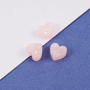 Three 8mm pink heart-shaped resin opal beads with holographic glitter for jewelry making