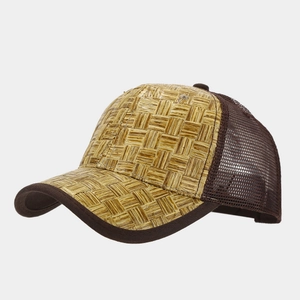 Detail of straw woven baseball cap featuring breathable mesh and vintage texture