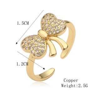 Detail view of copper bow ring showing 1.5cm width and 2.5g weight specifications