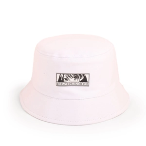 Detail of white cotton bucket hat featuring an embroidered cartoon eyes patch and text
