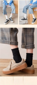 Close-up of vertical ribbed texture on cotton crew socks in black and white styles