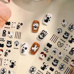 Minimalist 3D nail stickers featuring black and white cartoon bears and dogs