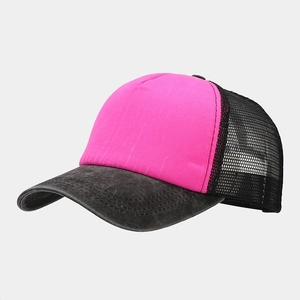 Detail of pink cotton front and black mesh back on a washed vintage trucker cap