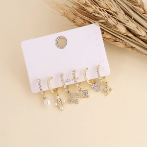 Detail view of 6-piece bohemian gold earring set with rhinestones and 925 silver posts