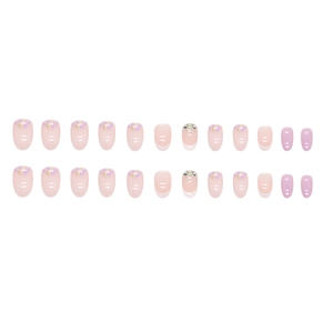 Faux ongles ovales rose lavande avec feuilles d'or, motifs floraux et strass brillants