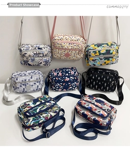 Multi-compartment nylon crossbody bags in diverse floral and geometric patterns