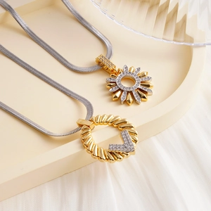 Elegant gold and silver sunflower and V-shaped necklaces with sparkling cubic zirconia stones