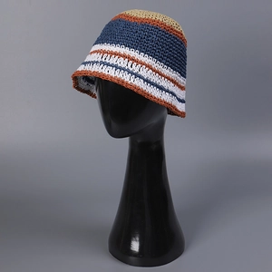 Stylish handmade striped straw bucket hat for women with a breathable summer design