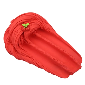 Detailed view of red ultra-light modeling clay with cherry decor and wavy texture