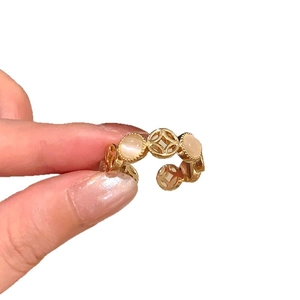 Vintage French style gold open ring with carved hollow design and orange cat-eye stone