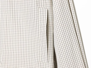 Macro detail of black and white checkered nylon fabric with precise stitching and seams