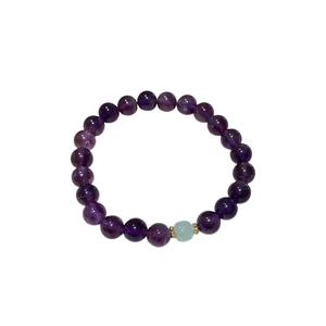 Elegant natural purple amethyst beaded bracelet with blue accent stone and gold spacers
