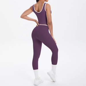 Detail of purple yoga set showing back fit with white contrast piping on sports bra and leggings