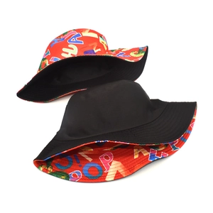 Reversible bucket hat featuring colorful alphabet print and solid black lining side