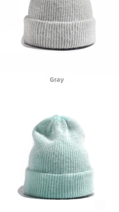 Detailed close-up of ribbed knit texture on gray and light green rabbit fur beanie hats