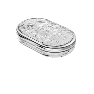 Portable mini oval pill box with metallic silver base and textured water ripple lid