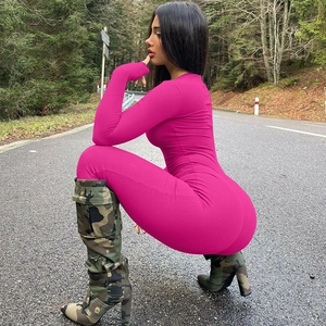 Detail of fuchsia long sleeve bodysuit with vertical ribbed knit texture for women
