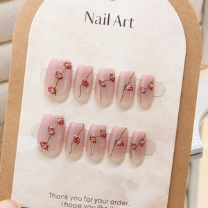 Handmade strawberry press-on nails set with translucent pink cat-eye jelly finish