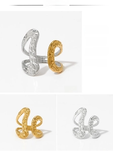 Detailed view of adjustable irregular texture rings in gold, silver, and two-tone finishes