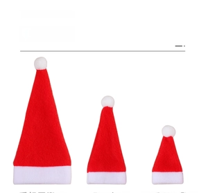 Three sizes of red Christmas hats with white trim for cutlery and bottle decor