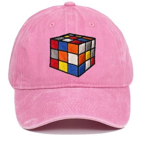 Close-up of cube pattern embroidery on a vintage pink washed cotton baseball cap