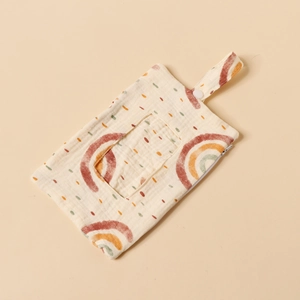 Detail of baby muslin wipes organizer bag with rainbow print and hanging strap buckle