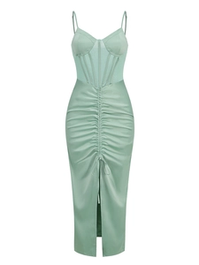 Detail of light green satin dress featuring ruched waist and sexy front slit design