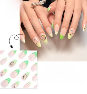 Detailed view of French green ombre almond press-on nails with colorful crystal rhinestones