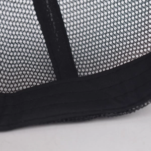 Detail shot of black mesh baseball cap showing reinforced seams and inner fabric edges