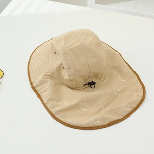 Detail of beige sun hat featuring quick-dry fabric, neck flap, and adjustable cord