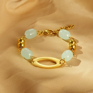 Vintage gold-plated stainless steel bracelet with green resin beads and oval pendant