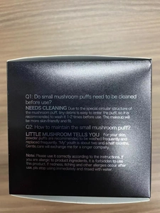 Detail of the black matte packaging box with small mushroom puff usage instructions