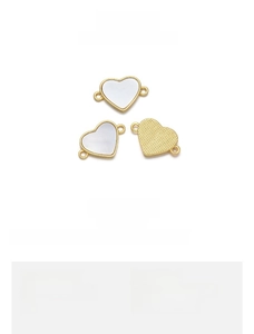 Detailed view of 18K gold plated heart shell pendant connectors for DIY jewelry